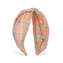 Fabric headband featuring a pink and orange check pattern.