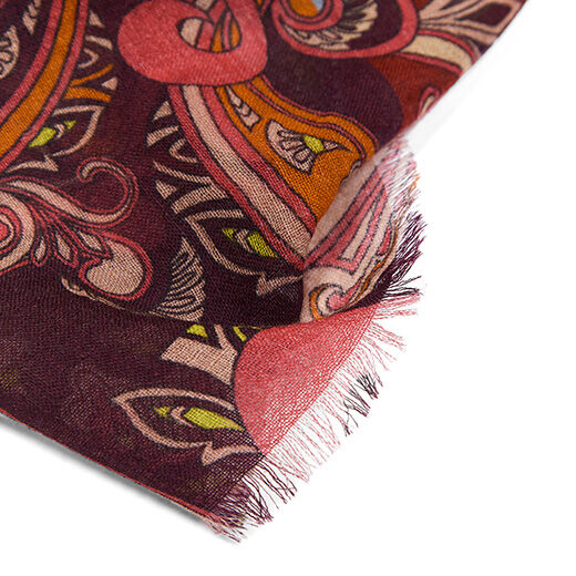 The textured edges of the scarf