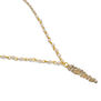 Detail of a pendant in the shape of a long pointy leaf, adorned with clear crystals.