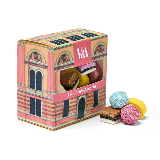 A decorated box of liquorice allsorts in cubes, lengths, rounds and squares.