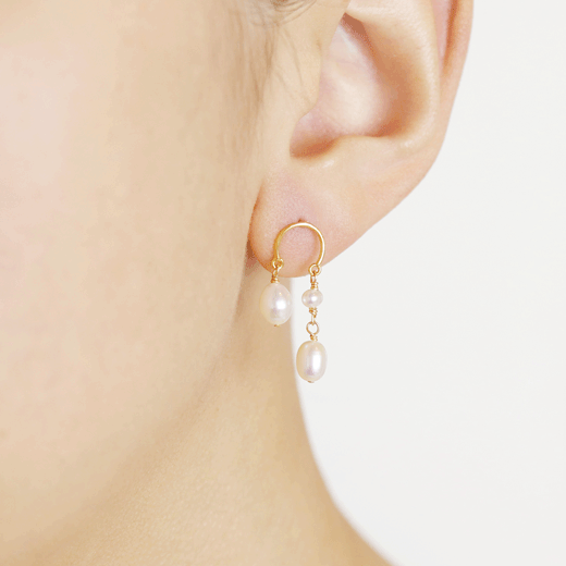 Pearl horseshoe drop earrings by Mounir