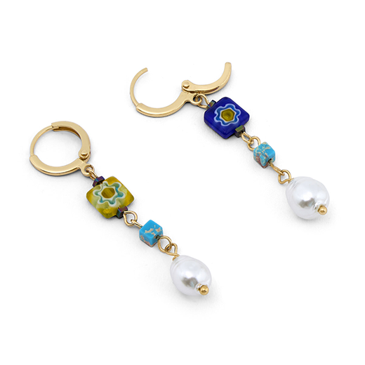 A detail showing the clasp of a pair of earrings adorned with Murano glass beads and faux pearls.