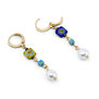 A detail showing the clasp of a pair of earrings adorned with Murano glass beads and faux pearls.