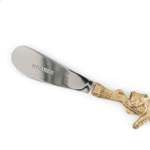 A detail of the tip of a butter knife.