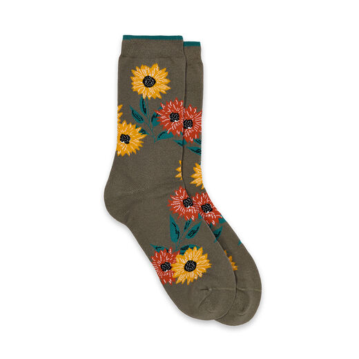 A pair of grey socks with a floral pattern featuring yellow and orange sunflowers.