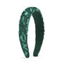 A sparkly cotton green headband, embellished with green sequins.
