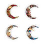 Four brooches in the shape of a crescent moon, each featuring colourful gleaming stones and glass beads.