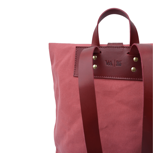 Red embossed backpack by Natthakur