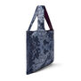 A navy blue tote bag featuring an intricate illustration of jewellery, seen from the side.