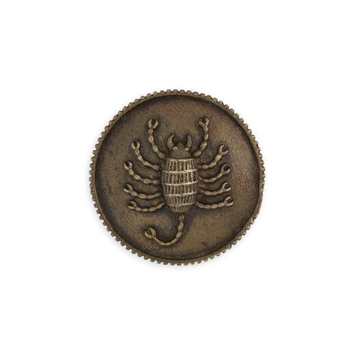 Brass button with embossed scorpio