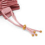 Close up of a pink fabric bracelet.