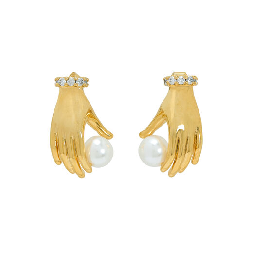 Gold hand-shaped stud earrings holding imitation pearls, with jeweled cuffs.