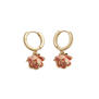 A pair of gold huggie earrings with pink rosebud shaped pendants.