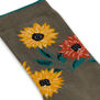 A close up of a sock with a pattern featuring sunflowers.