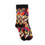 A pair of socks shot from above against a white background. The socks are black with an Art Deco pattern of geometric forms in red, cream and blue colours.