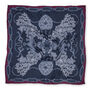 A square navy blue scarf with a purple border. It features a print of an intricate illustration of ornate jewellery items.