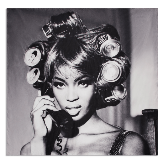A square scarf featuring a black and white photograph of a model holding up a telephone to her ear and wearing cans as hair rollers.