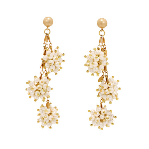 A pair of statement gold earrings featuring clusters of small white faux pearls. 