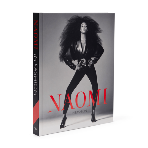Book cover of Naomi: In Fashion. It features a black and white photo of a model dressed in black.