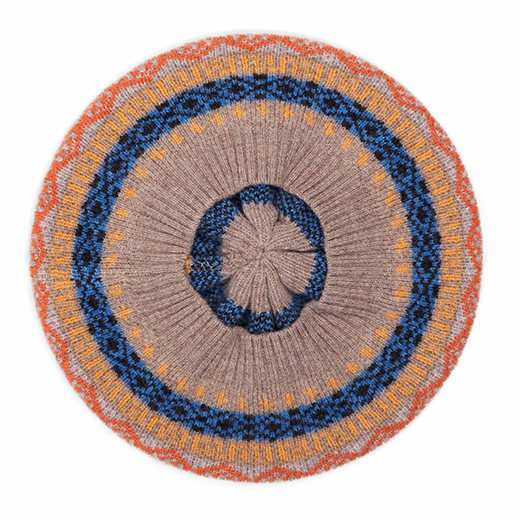 The back of a beret with a blue, green, and yellow pattern.