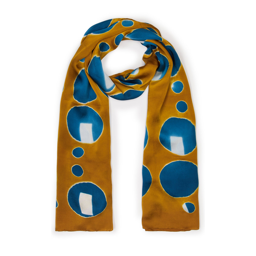 A yellow and blue scarf wrapped up on a white background.