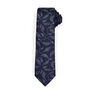 A luxury silk necktie featuring a V&A Archive pattern in navy with leafy flourishes