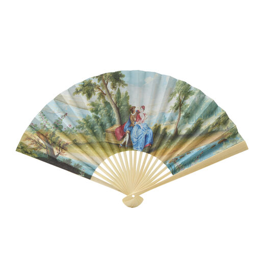 Paper hand fan featuring a reproduction of a painting depicting two lovers court dresses sittingin a idyllic landscape.