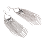 A pair of silver earrings with a cluster of chains. 