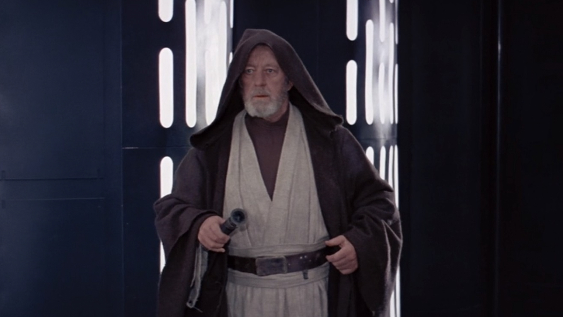 Obi Wan Kenobi from Star Wars in his jedi robes holding a lightsaber