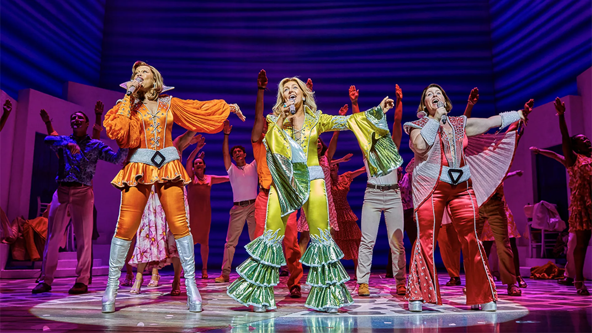 Cast of Mamma Mia performing