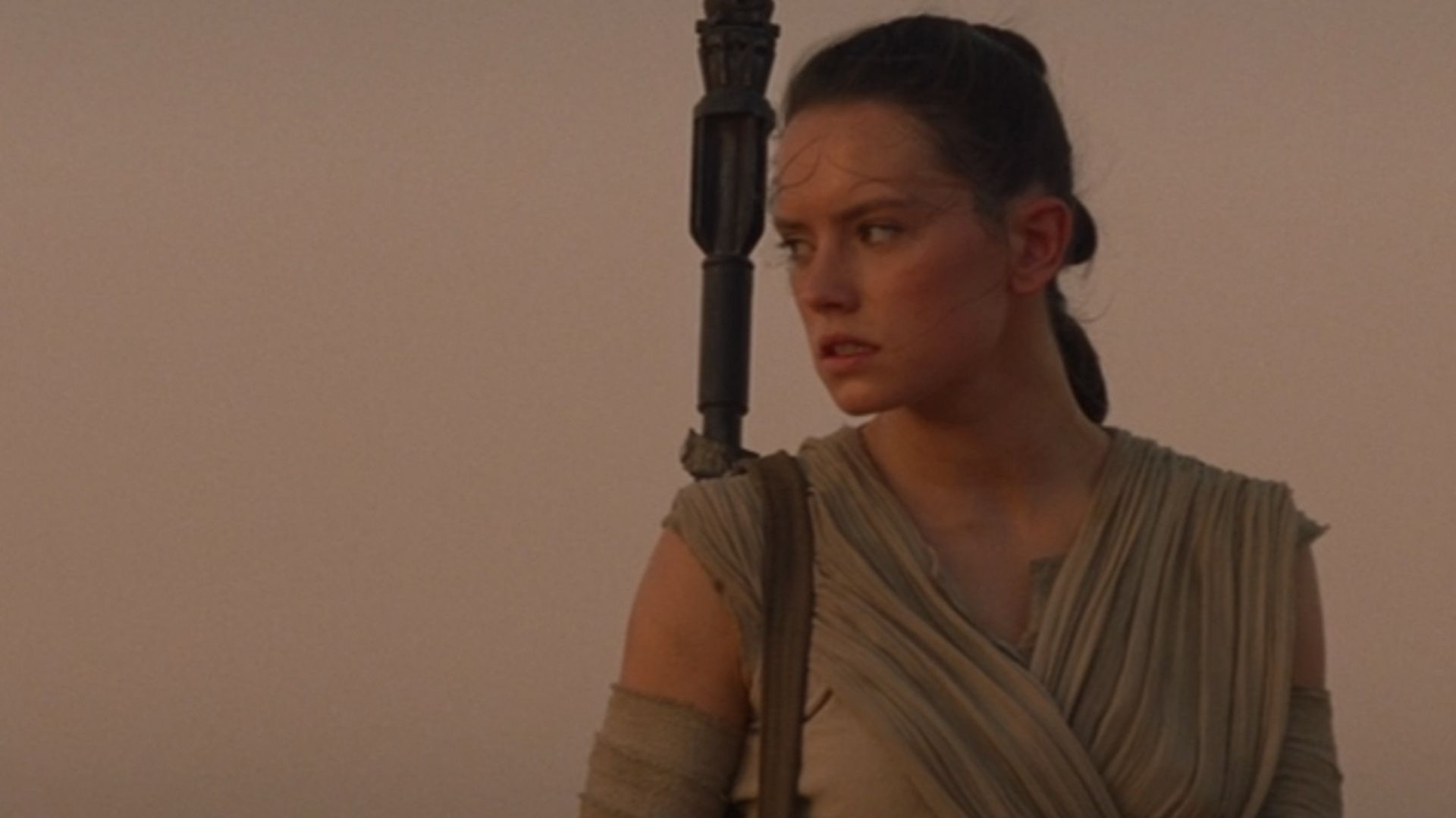 Rey from Star Wars in her scavenger outfit