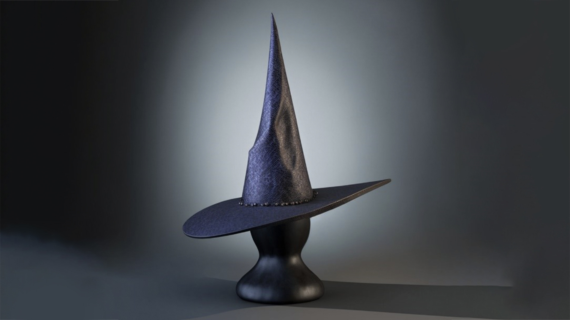 Dark blue fabric witches hat with wide brim