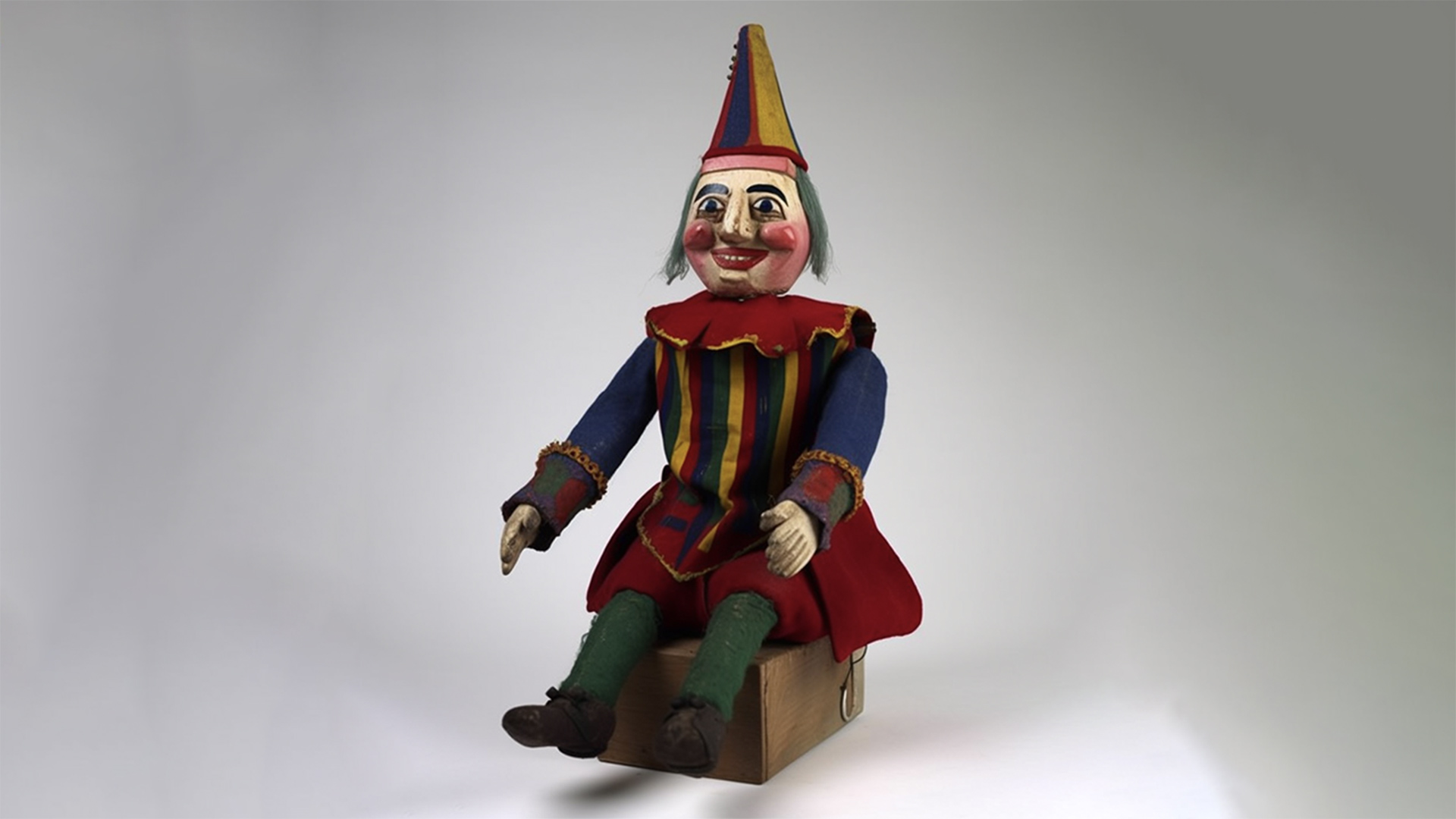 Seated puppet of Mr Punch