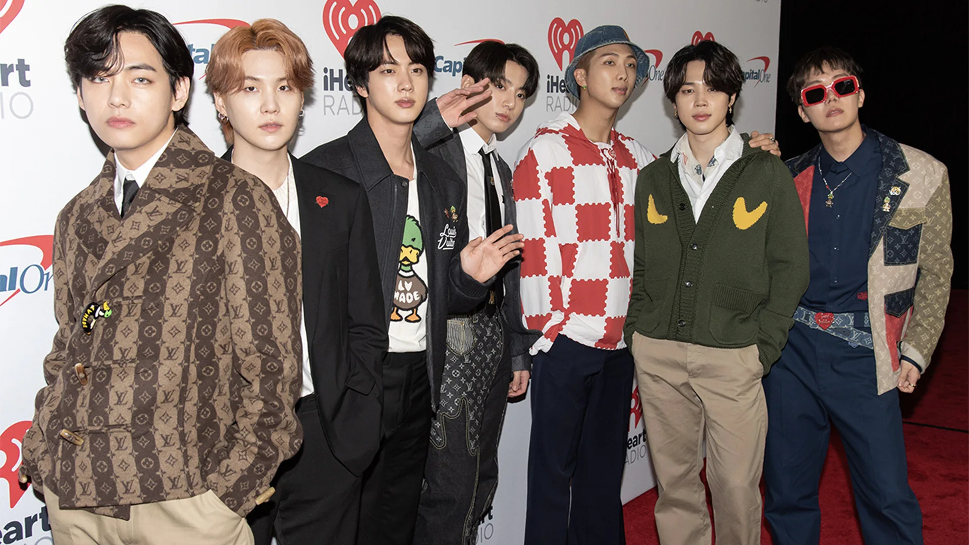 BTS band on the red carpet. From left to right: V, Suga, Jin, Jungkook, RM, Jimin, and J-Hope of BTS attends iHeartRadio 102.7 KIIS FM Jingle Ball.