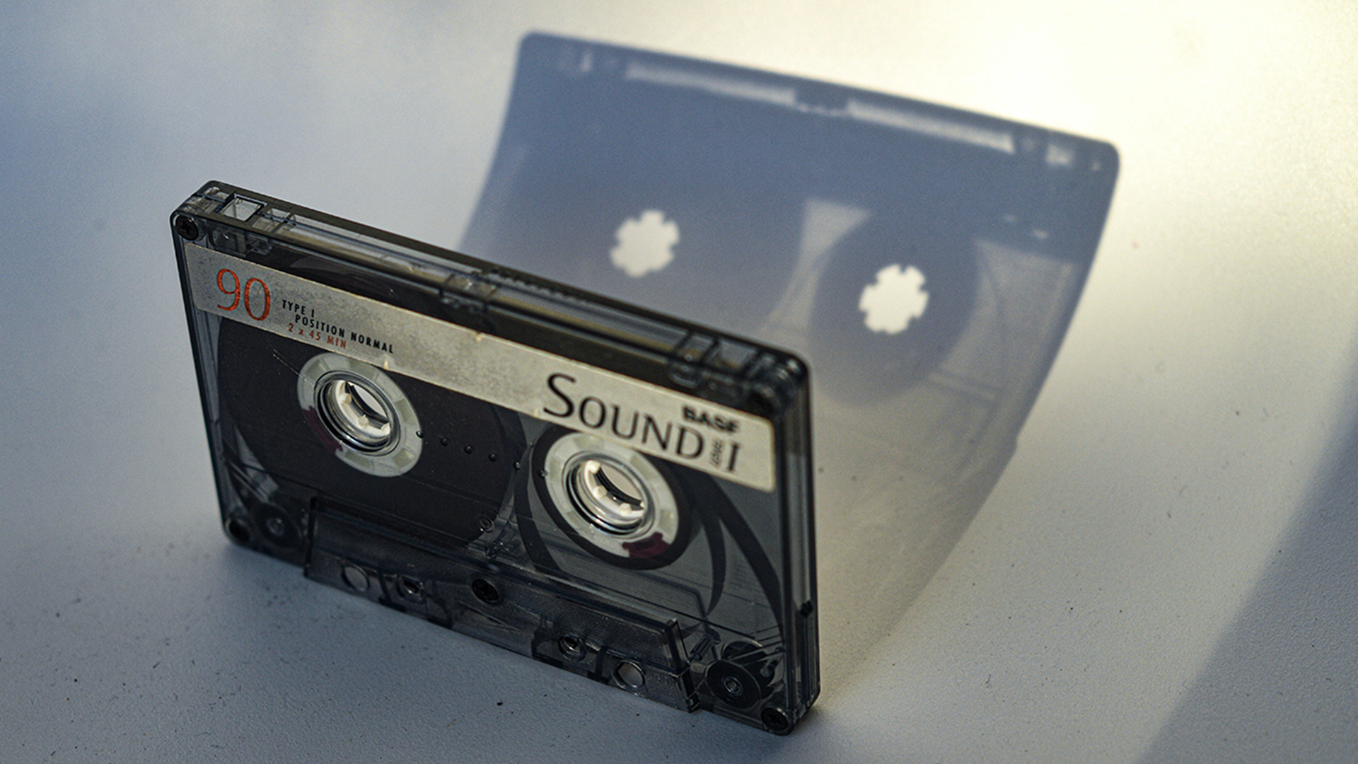 Black cassette tape on white table