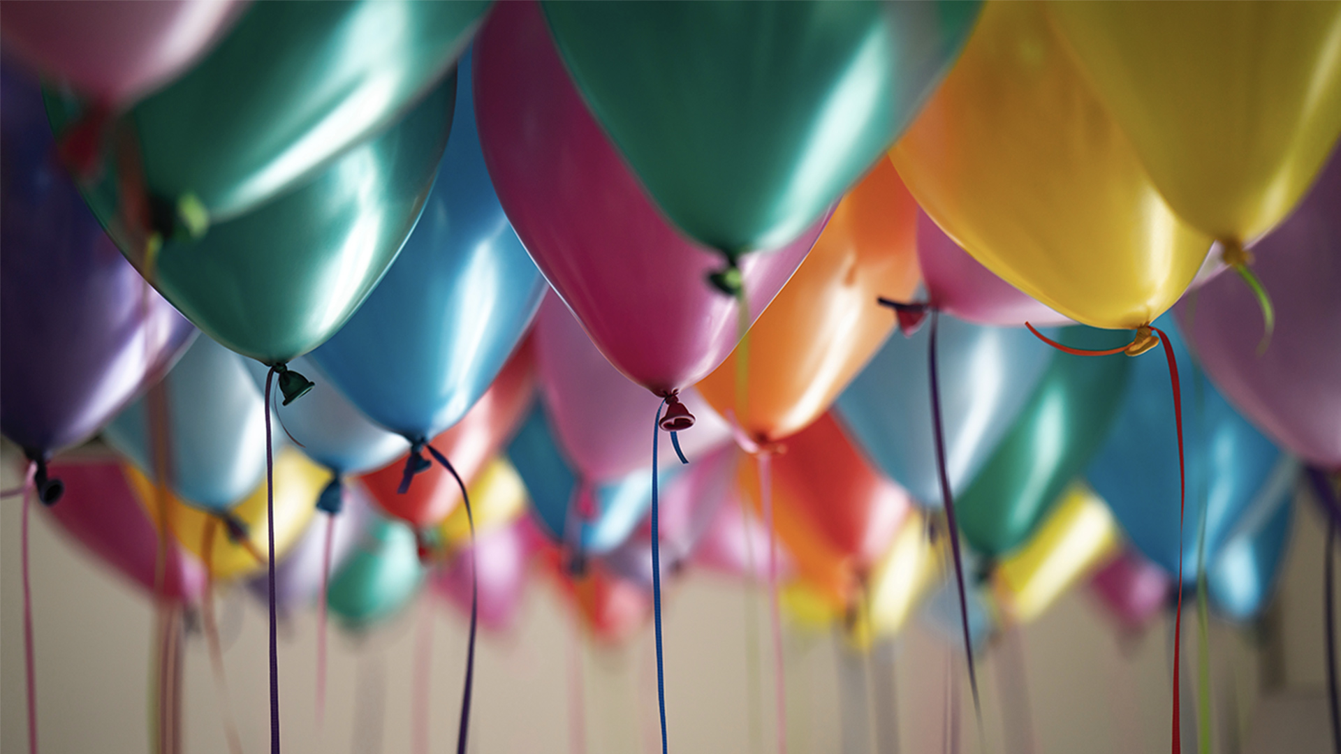 Multicoloured helium balloons floating