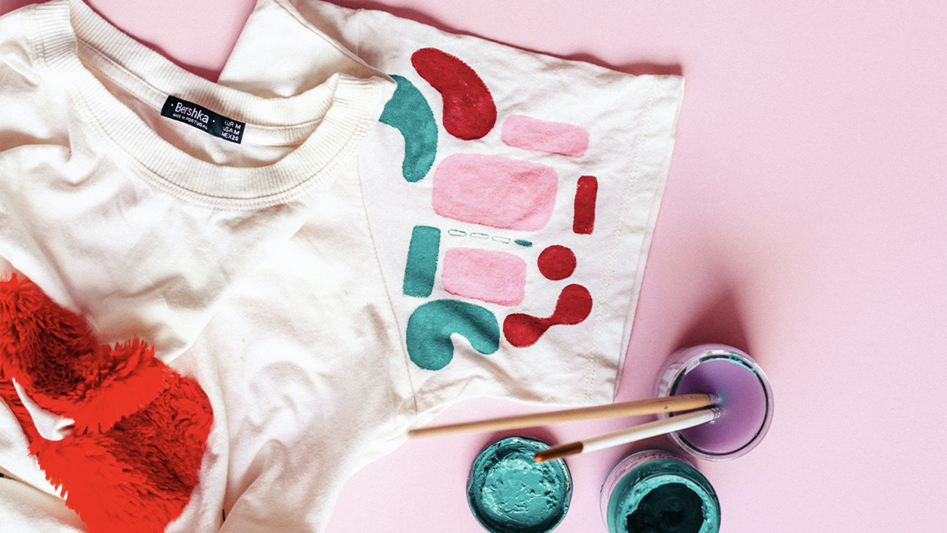 T-shirt customised with colourful paints