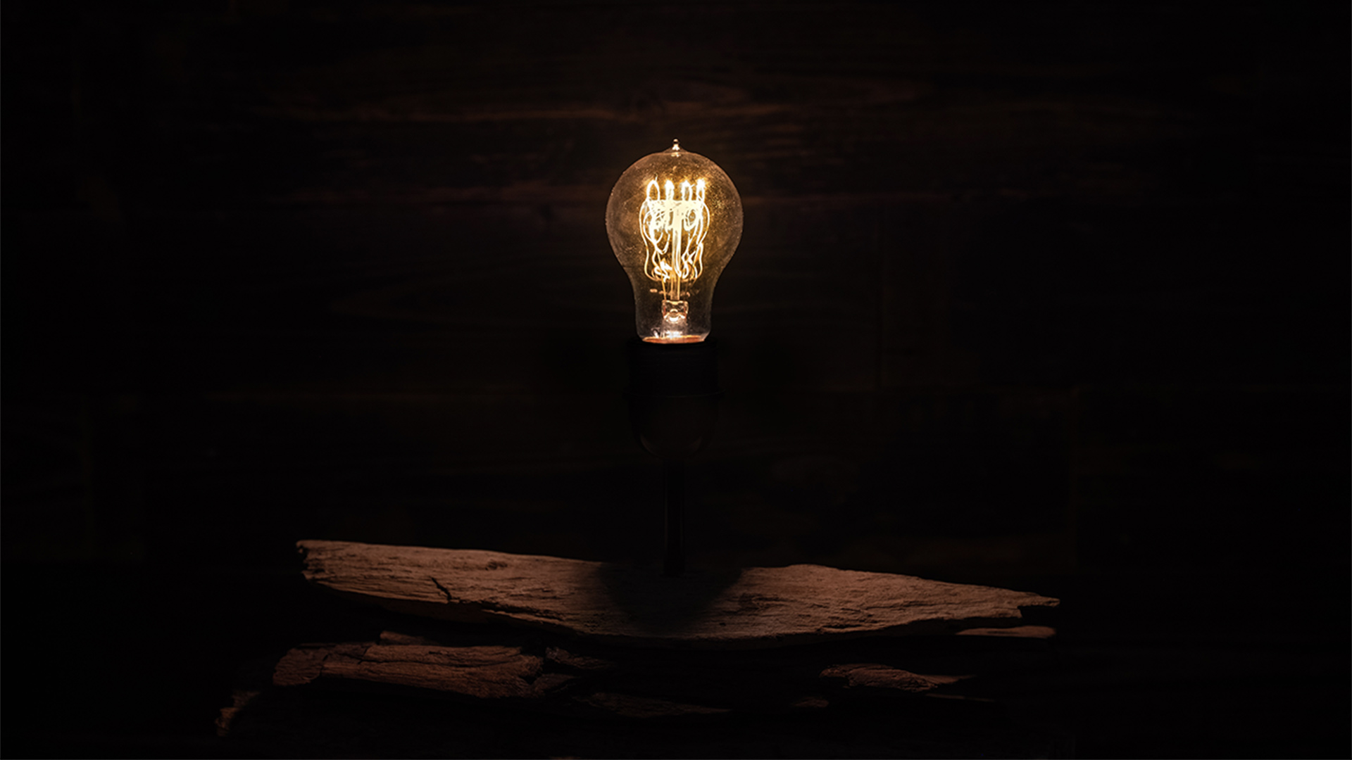 Vintage style lightbulb in a dark room