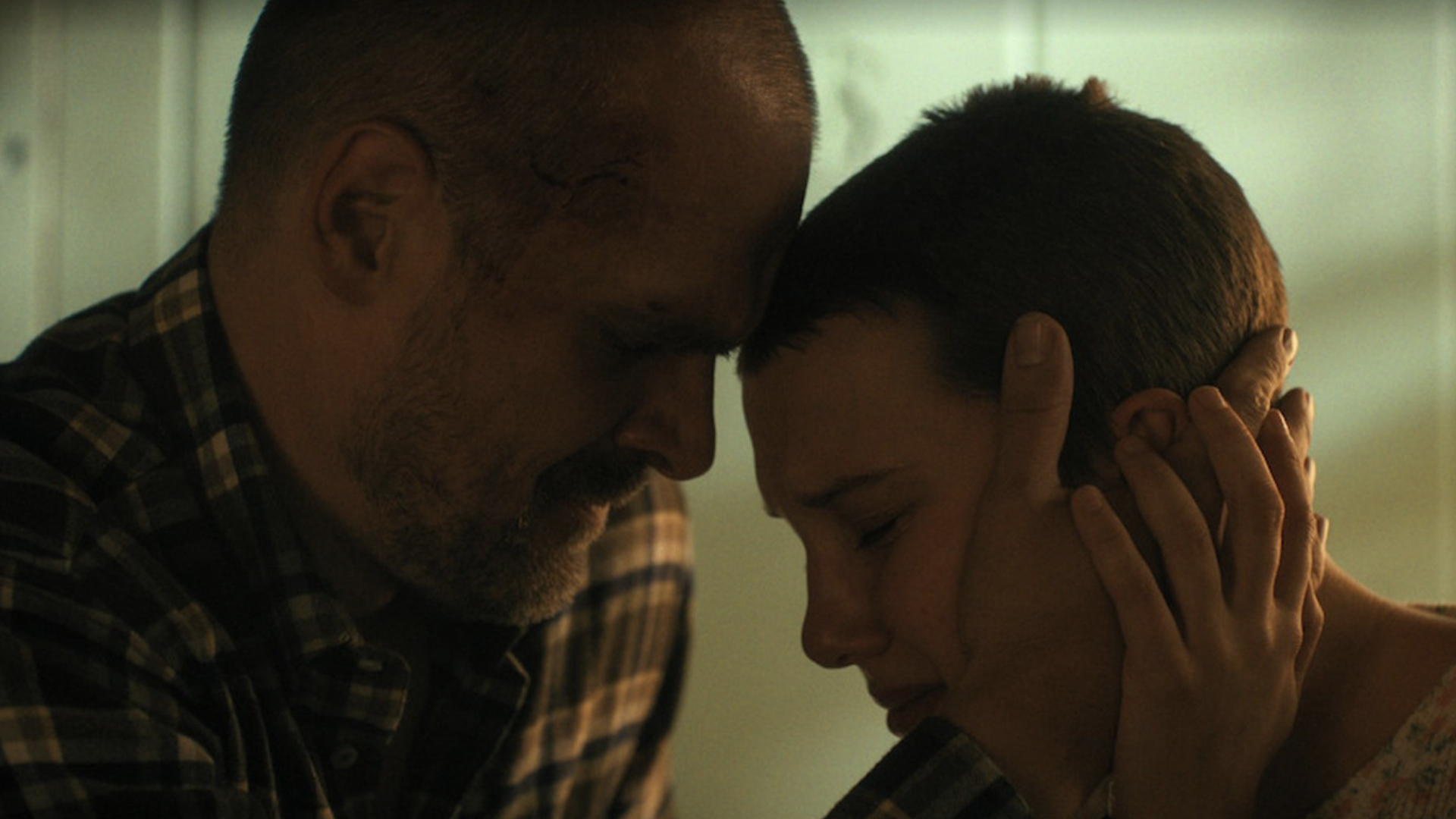Hopper and Eleven embrace each other