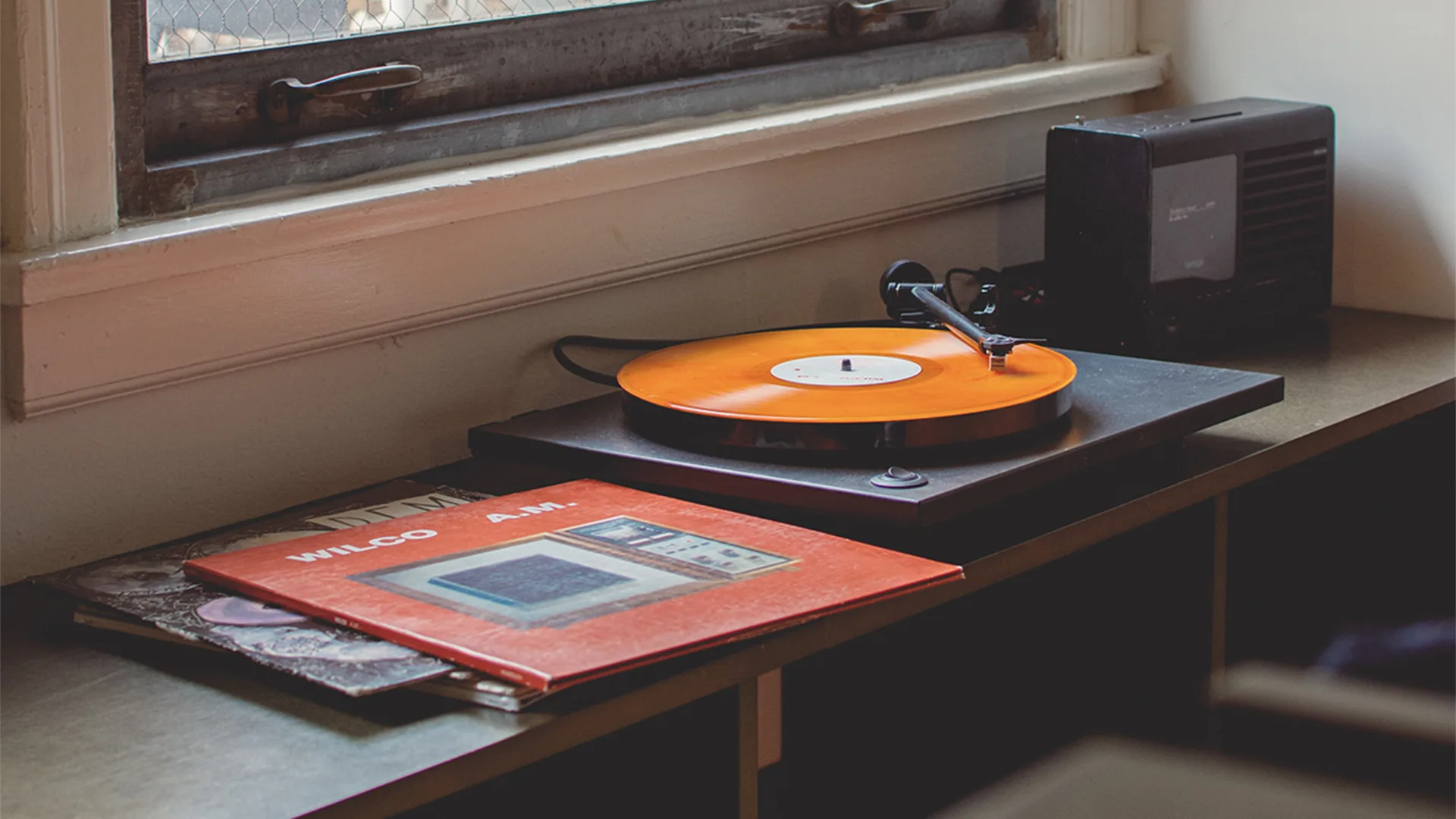 Record player with orange vinyl
