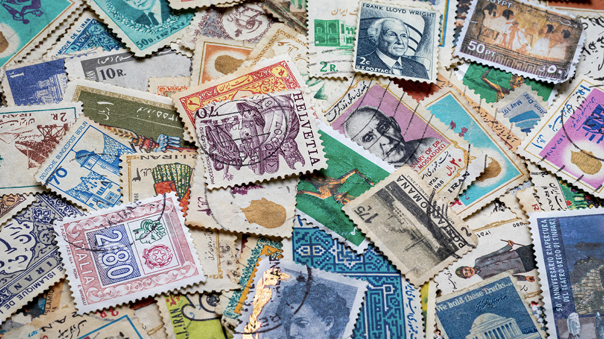 Large pile of old stamps