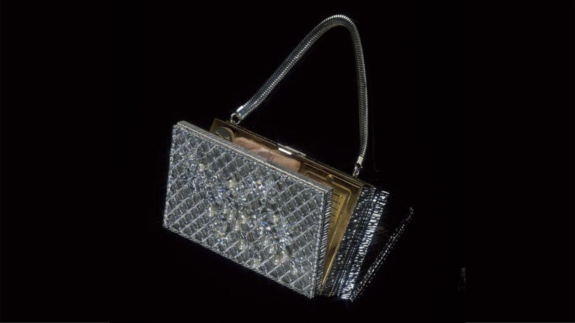Handbag decorated with faux pearls