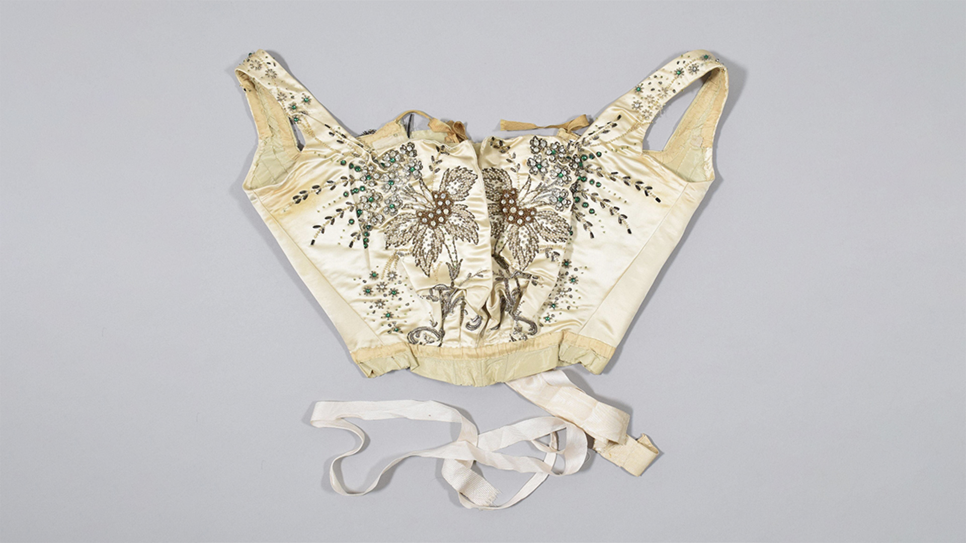 Satin corset from a court dress with embroidered flowers