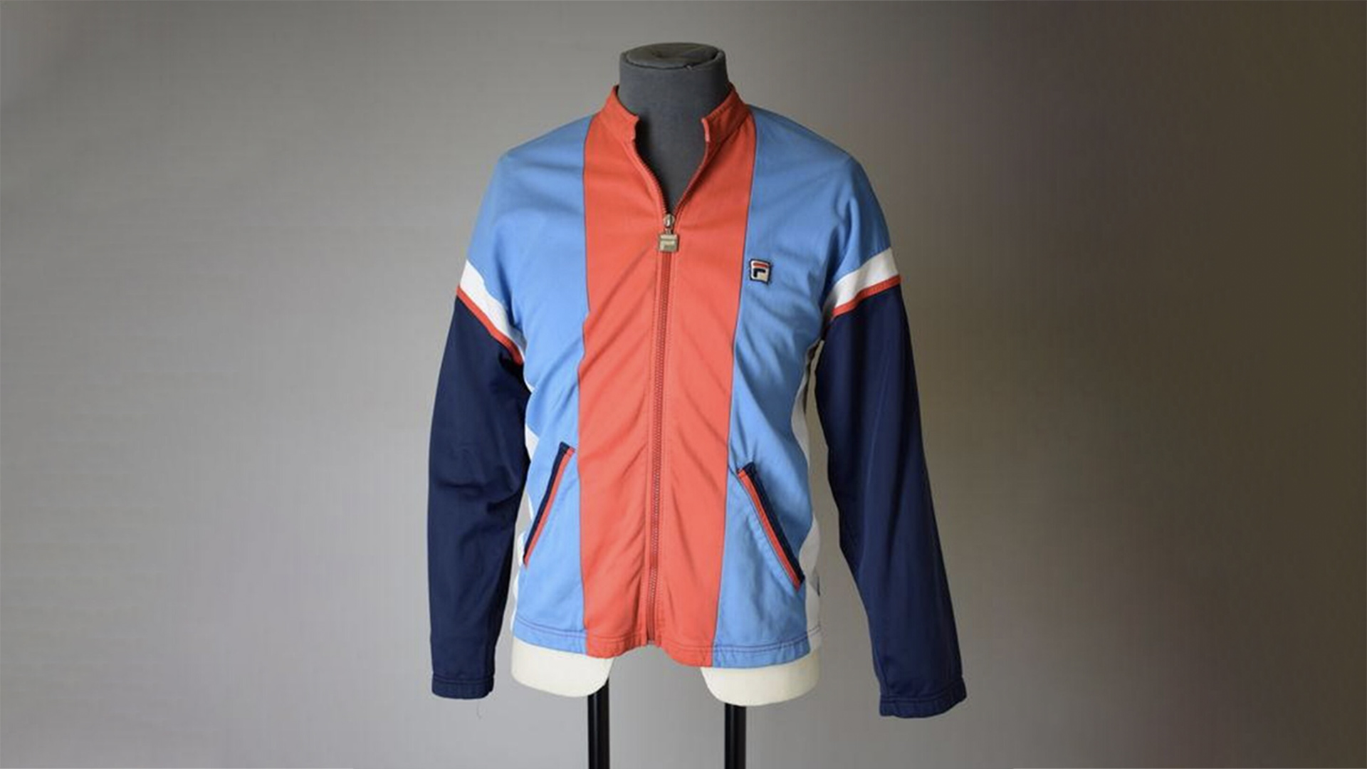Blue and orange striped Fila jacket