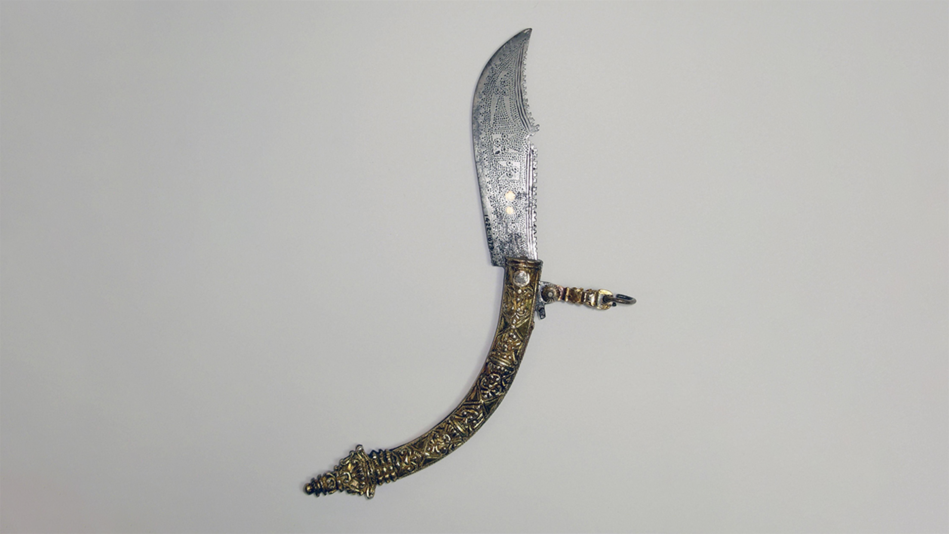 Silver curved knife with decorated handle