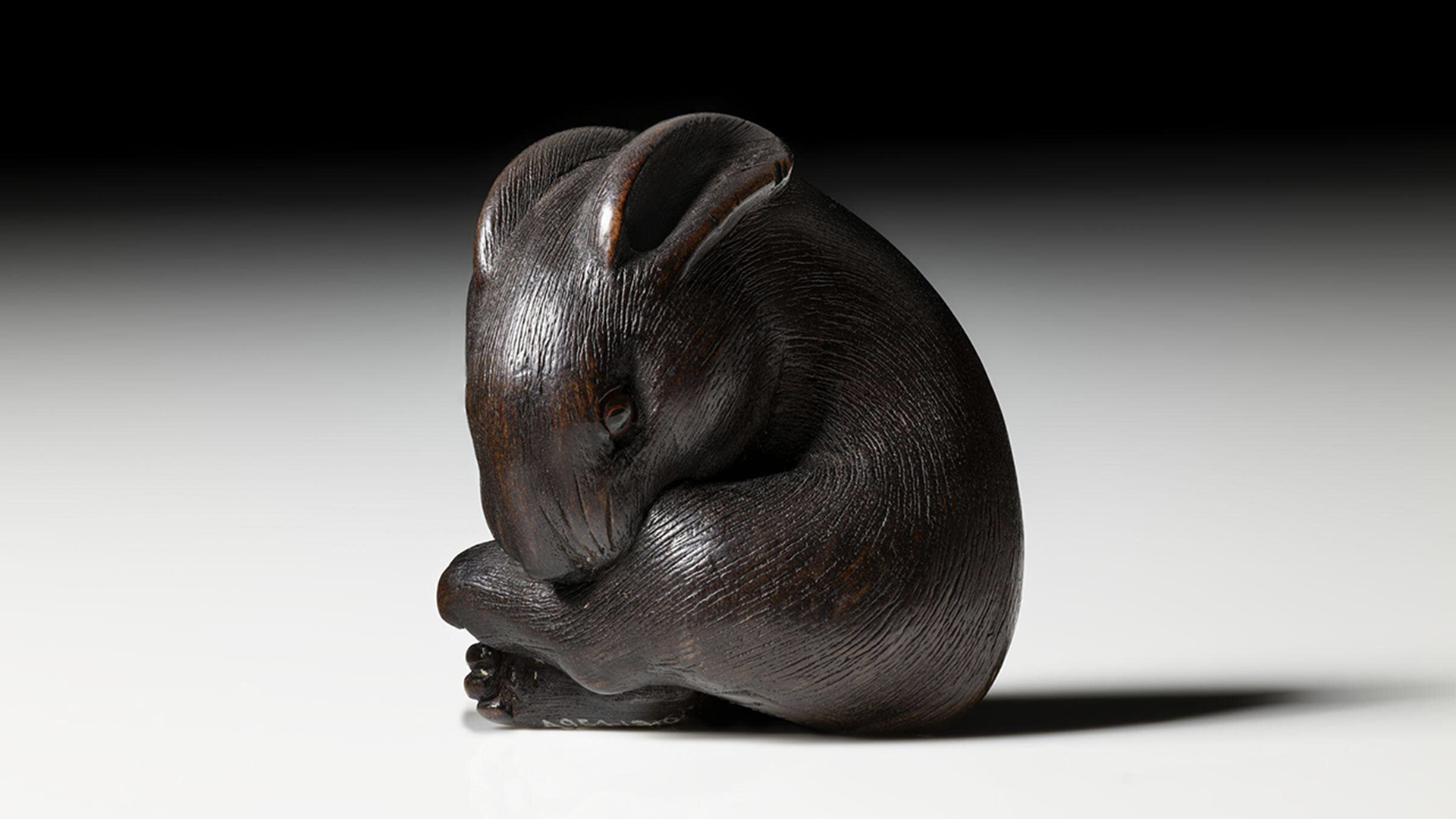 Miniature wooden carving of a mouse