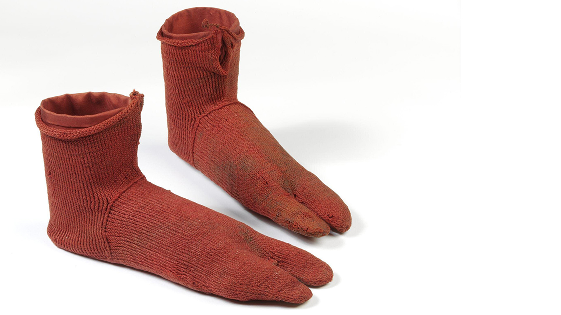 Dirty red woollen socks
