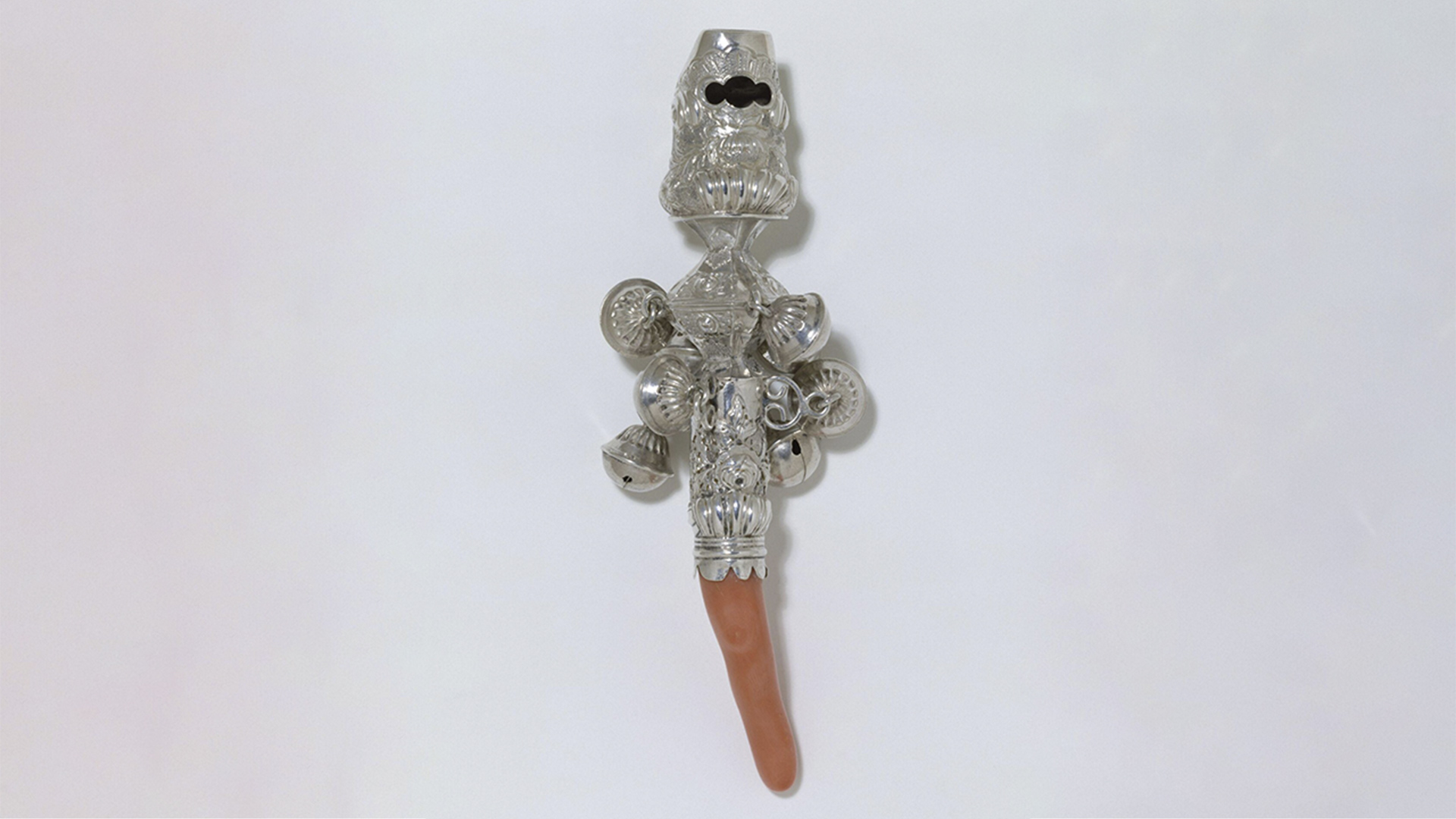 Silver and coral object with bells