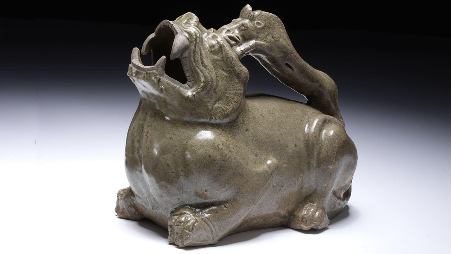 Stoneware urinal in the shape of a dragon