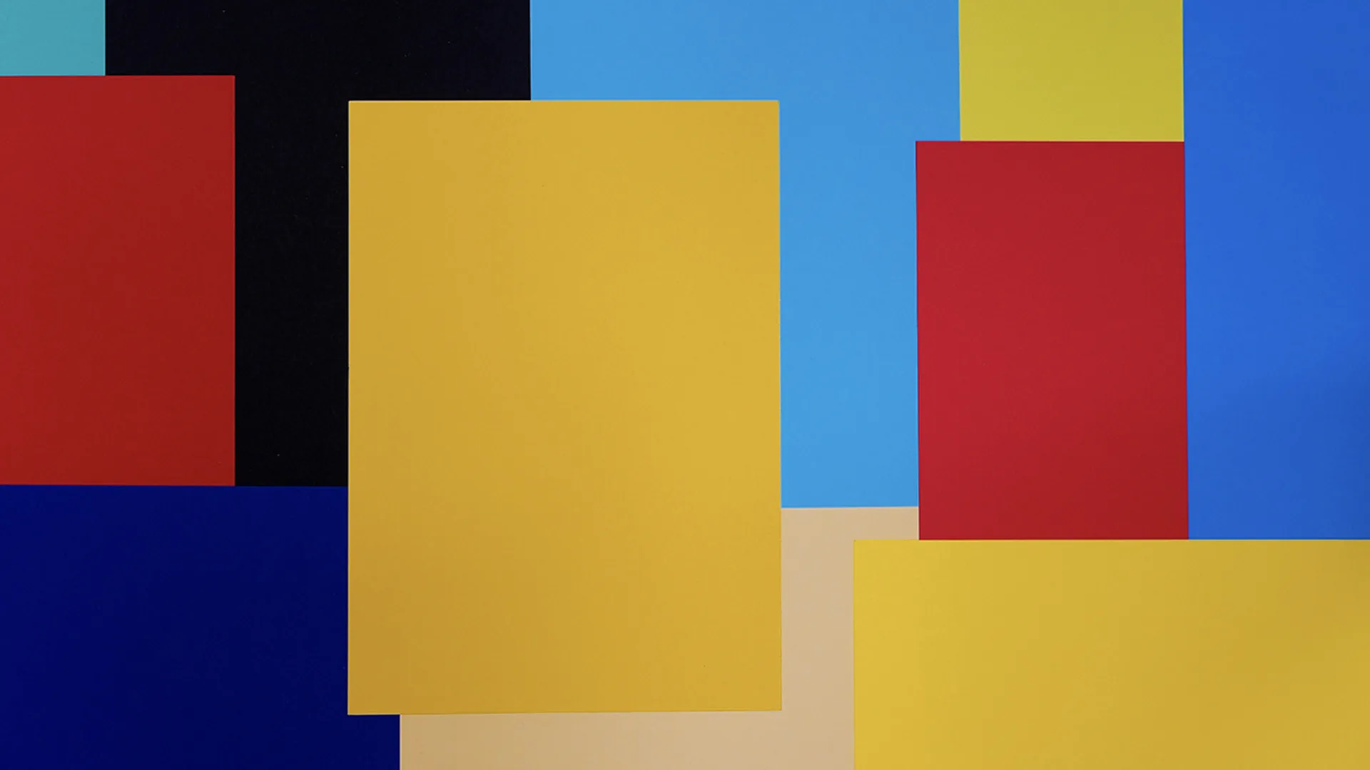 Blocks of primary colours, black and beige